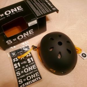 Brand New! S*One helmet size medium. Solid black. Yellow straps/detail